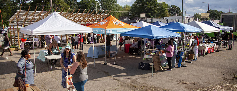 Vendors and visitors at the East Warren Farmers Market in August